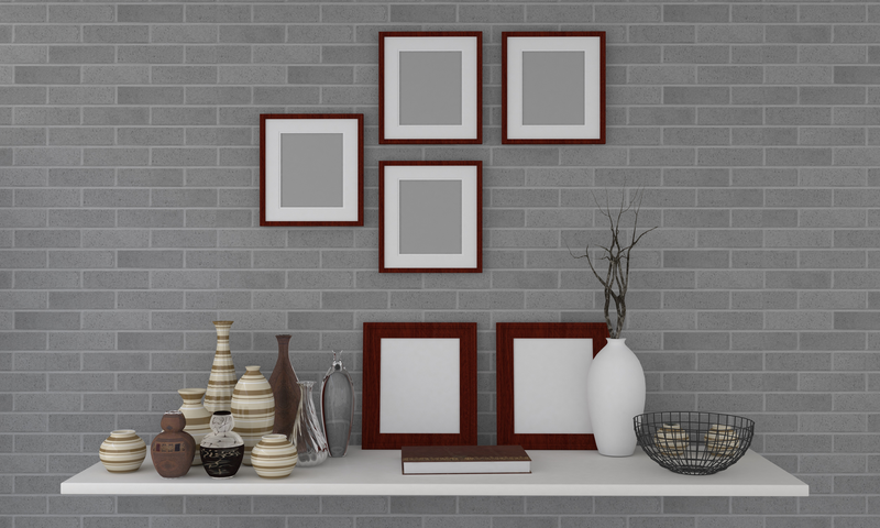 wooden photo frames with decorative vases on a floating shelf